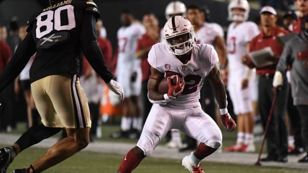 Sep 18, 2021; Nashville, Tennessee, USA; Stanford Cardinal running back E.J. Smith (22) runs for a first down against the Vanderbilt Commodores during the first half at Vanderbilt Stadium.